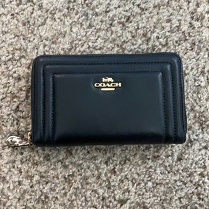 Coach wallet with snakeskin zipper detail